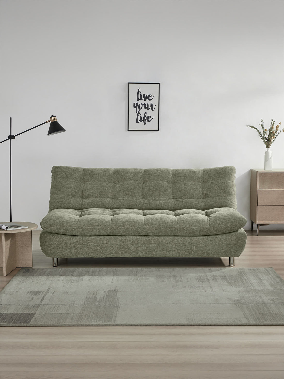 Sofá Cama Helsinki verde, en un espacio decorado